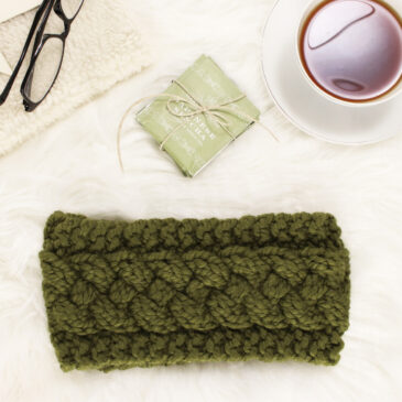 woven cable knit headband on a fur blanket with tea