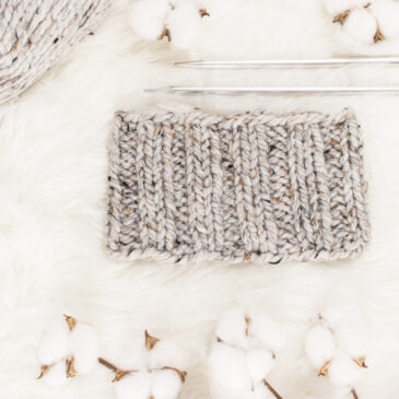 chunky knit headband on a fur rug