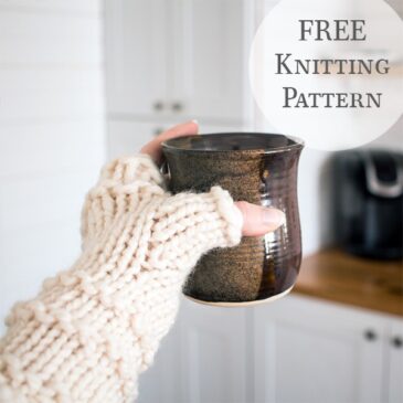 hand model wearing chunky knit fingerless gloves holding a mug
