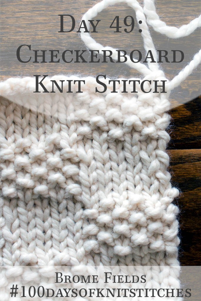 knitted swatch on a wood table