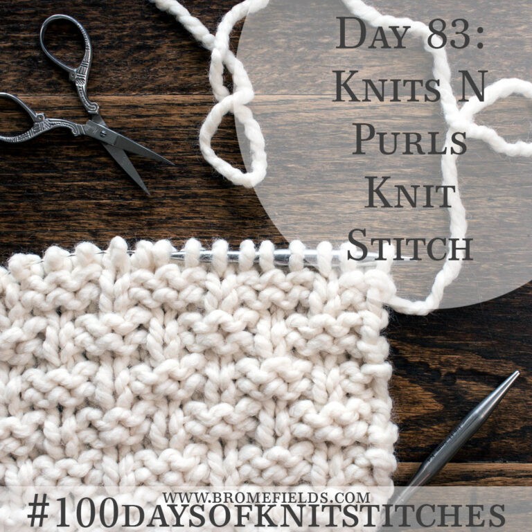 knitted swatch on a wood table