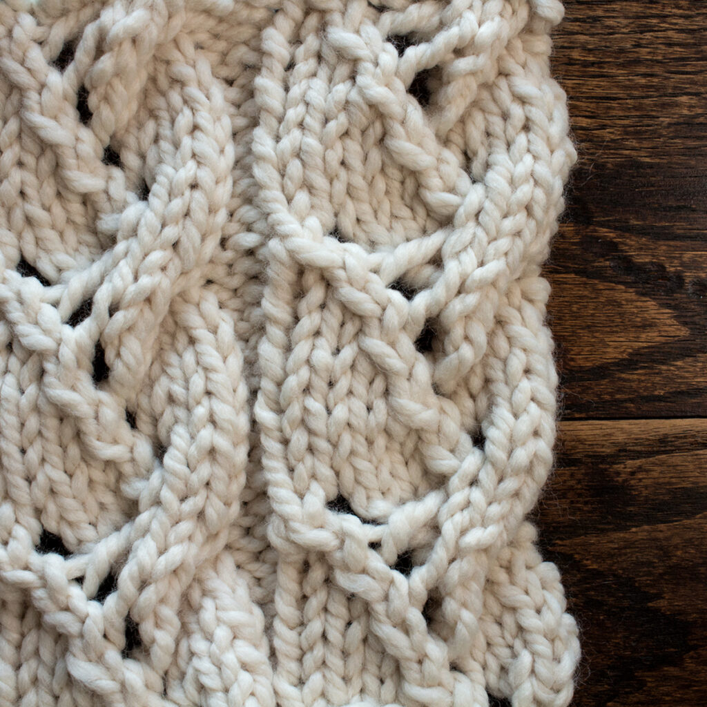 Swatch of the Lacy Plait Cable Knitting Stitch