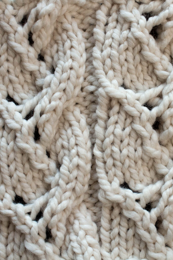 Swatch of the Lacy Plait Cable Knitting Stitch