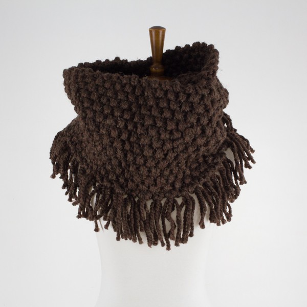 knit cowl with fringe displayed on a dress form