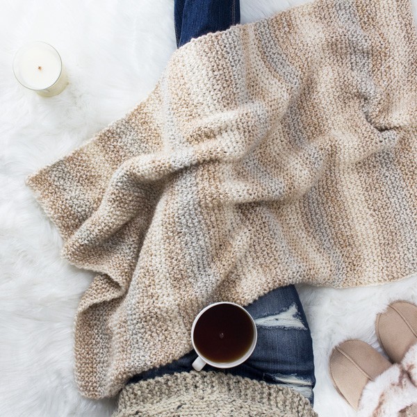 knit blanket on a fur blanket