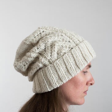 model wearing a bulky knit hat