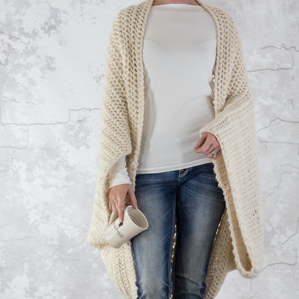 model wearing a knit shrug that looks like crochet