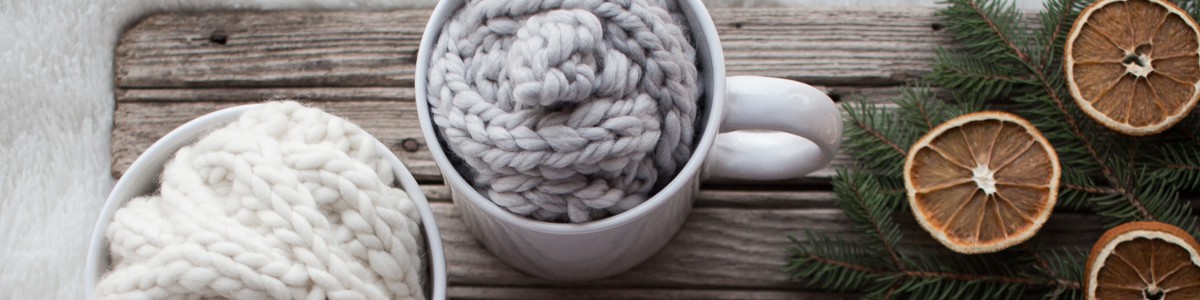 Christmas gifts of knitted headbands in large coffee mugs