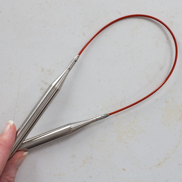 interchangeable needle set held in a loop