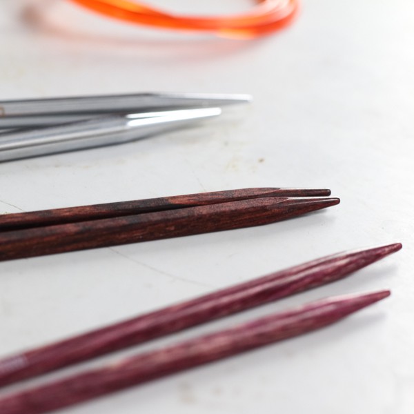 interchangeable needle set with cables laying on a metal table