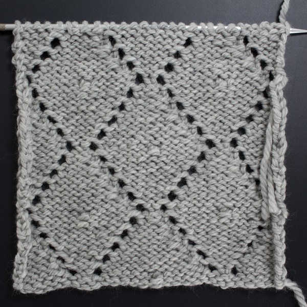 Back side of the Diamonds & Knots Lace Knit Stitch swatch
