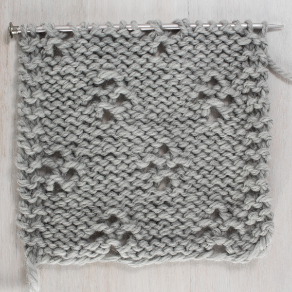 Up-close Photo of the Back Side of the Diamond Lace Knit Stitch