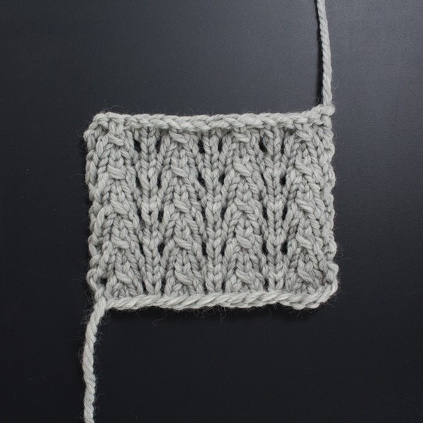 Up-close Photo of the Front Side of the Little Fountain Lace Knit Stitch