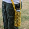 Knitted yellow water bottle sling in a hydro flask.