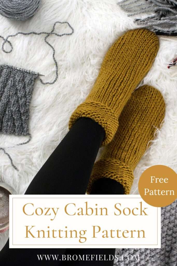 a cozy setting with chunky knitted socks, coffee, leaves on a fur blanket.