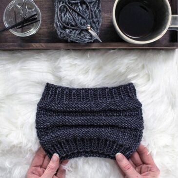 cozy scene of a messy bun knit headband on a fur blanket