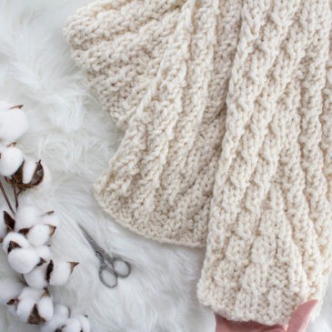 knit chevron scarf on a fur blanket