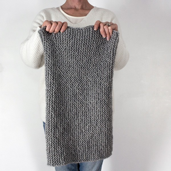 knit cowl held in front of a model