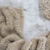 knit scarf on a fur blanket