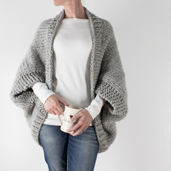 model wearing a hand knit chunky shrug sweater
