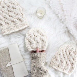 cable knit hat laying on a fur blanket