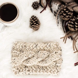 cozy scene of a cable knit headband on a fur blanket