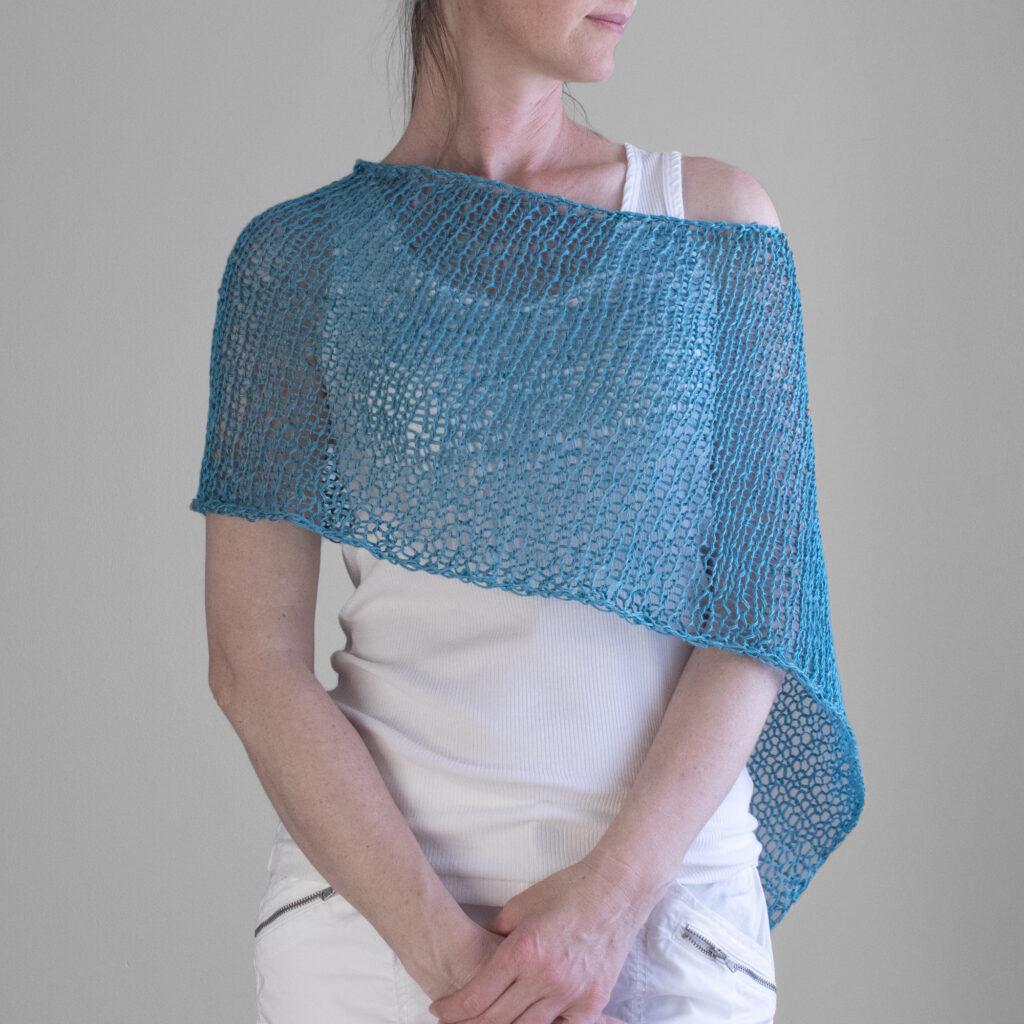 Front view photo of the poncho on a model.