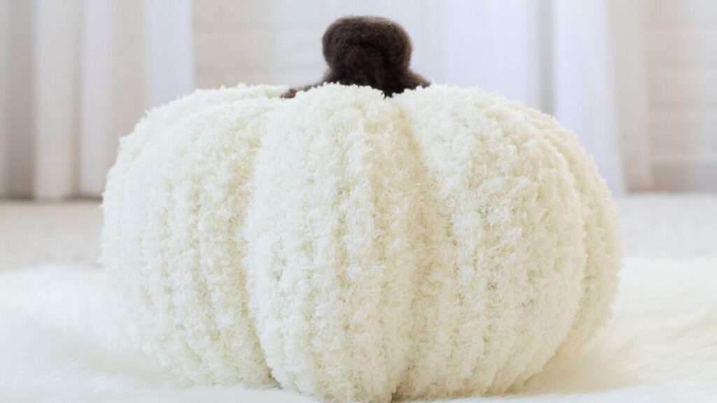 side profile of a hand knit pumpkin
