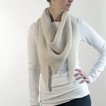 pic of a knitted shawl worn like a scarf