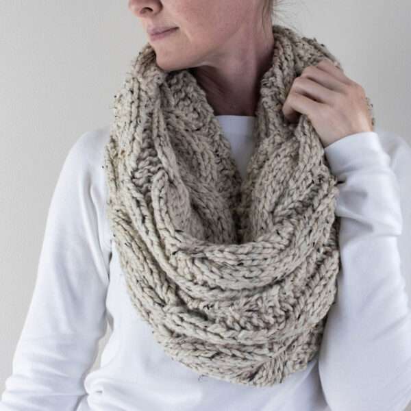 model wearing a chunky cable knit infinity scarf