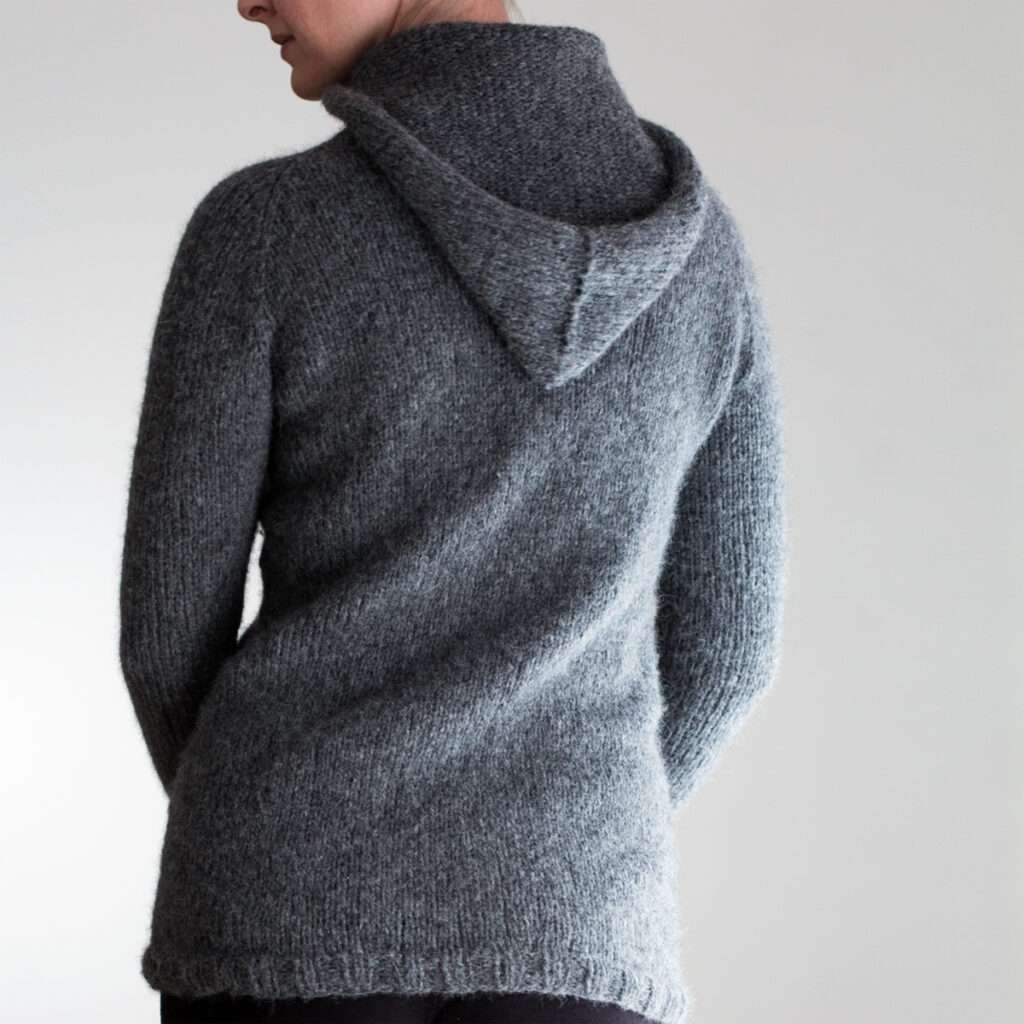 model wearing a fuzzy knit sweater hoodie