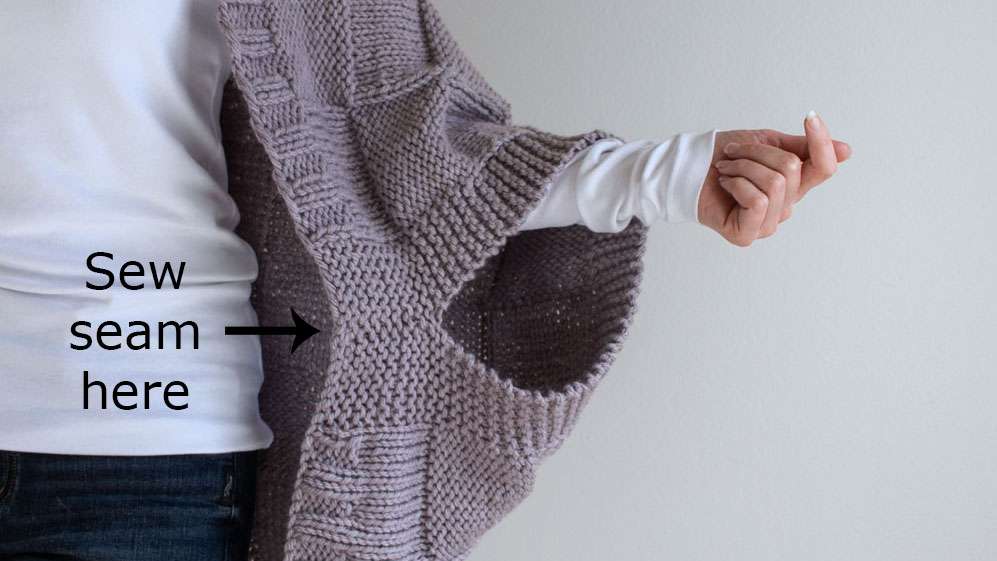 model wearing a hand knit patchwork shrug