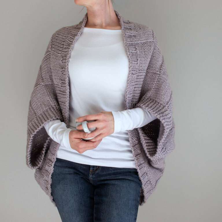 model wearing a hand knit patchwork shrug