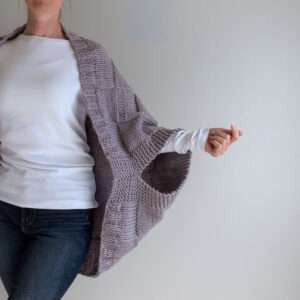 model wearing a hand knit patchwork shrug