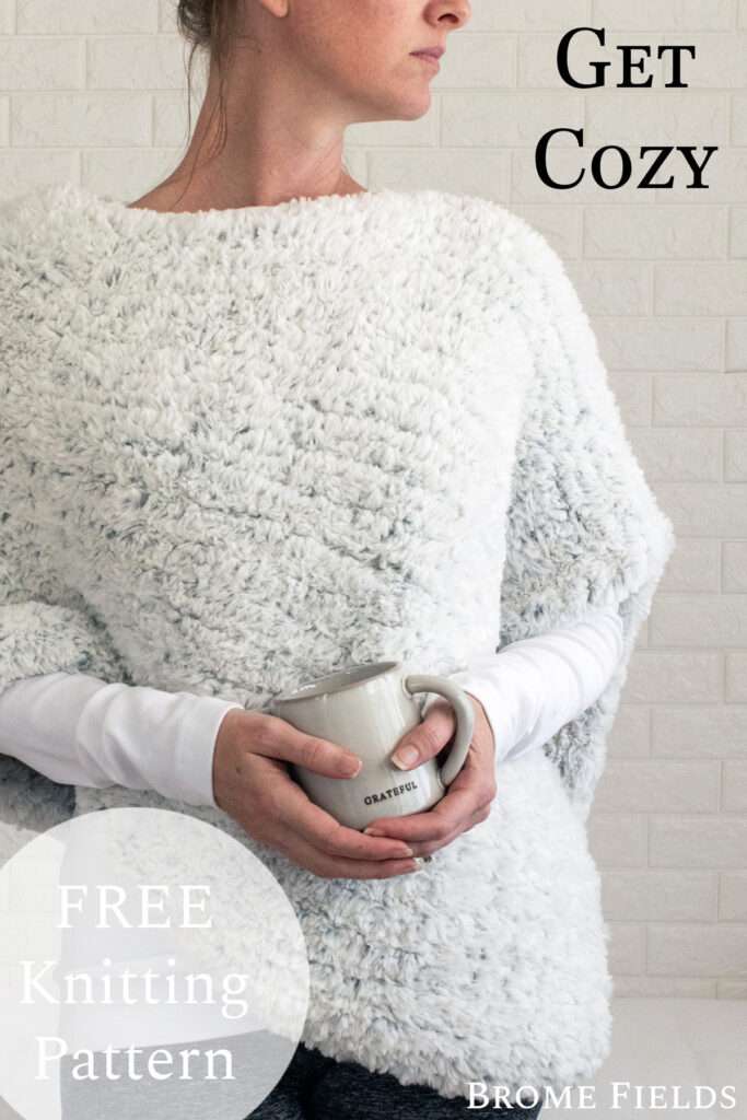 model wearing a hand knit faux fur poncho