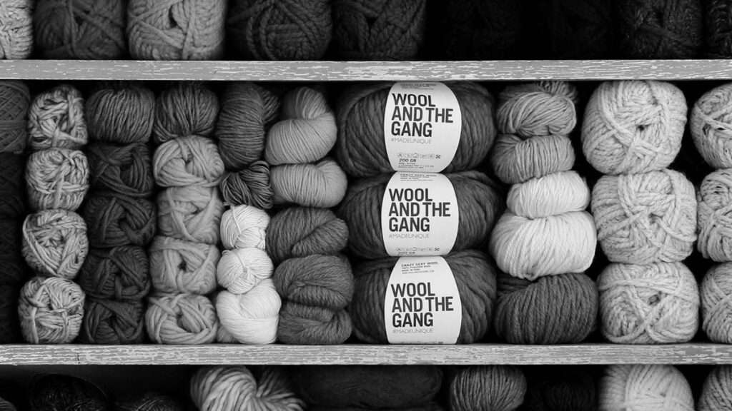 shelf stuffed with pretty stacks of yarn