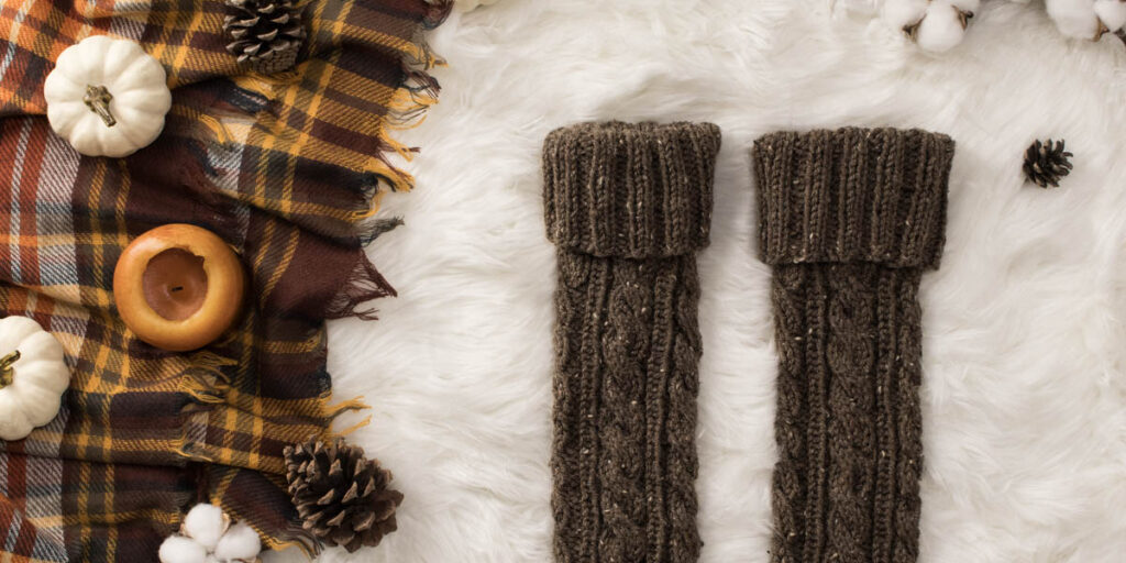 cable knit leg warmers on a faux fur blanket in a cozy setting