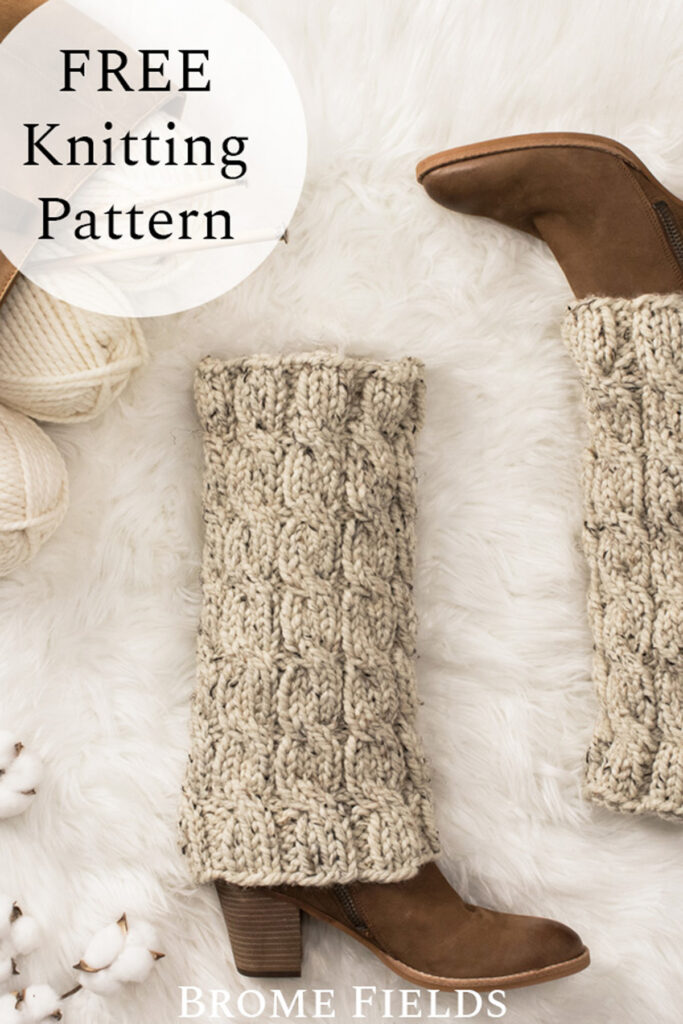 chunky cable knit leg warmers on a faux fur blanket in a cozy setting with boots & balls of yarn