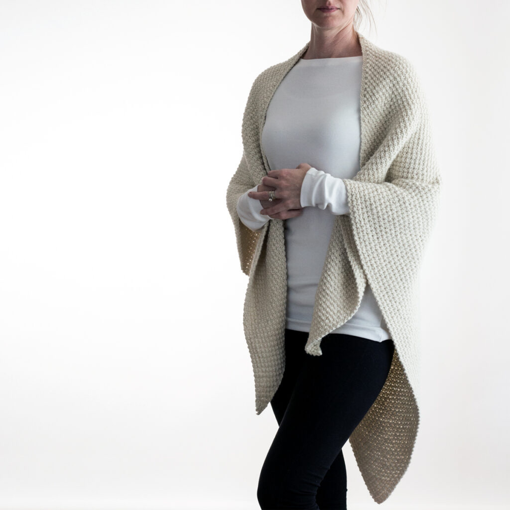 model wearing a hand knit shawl