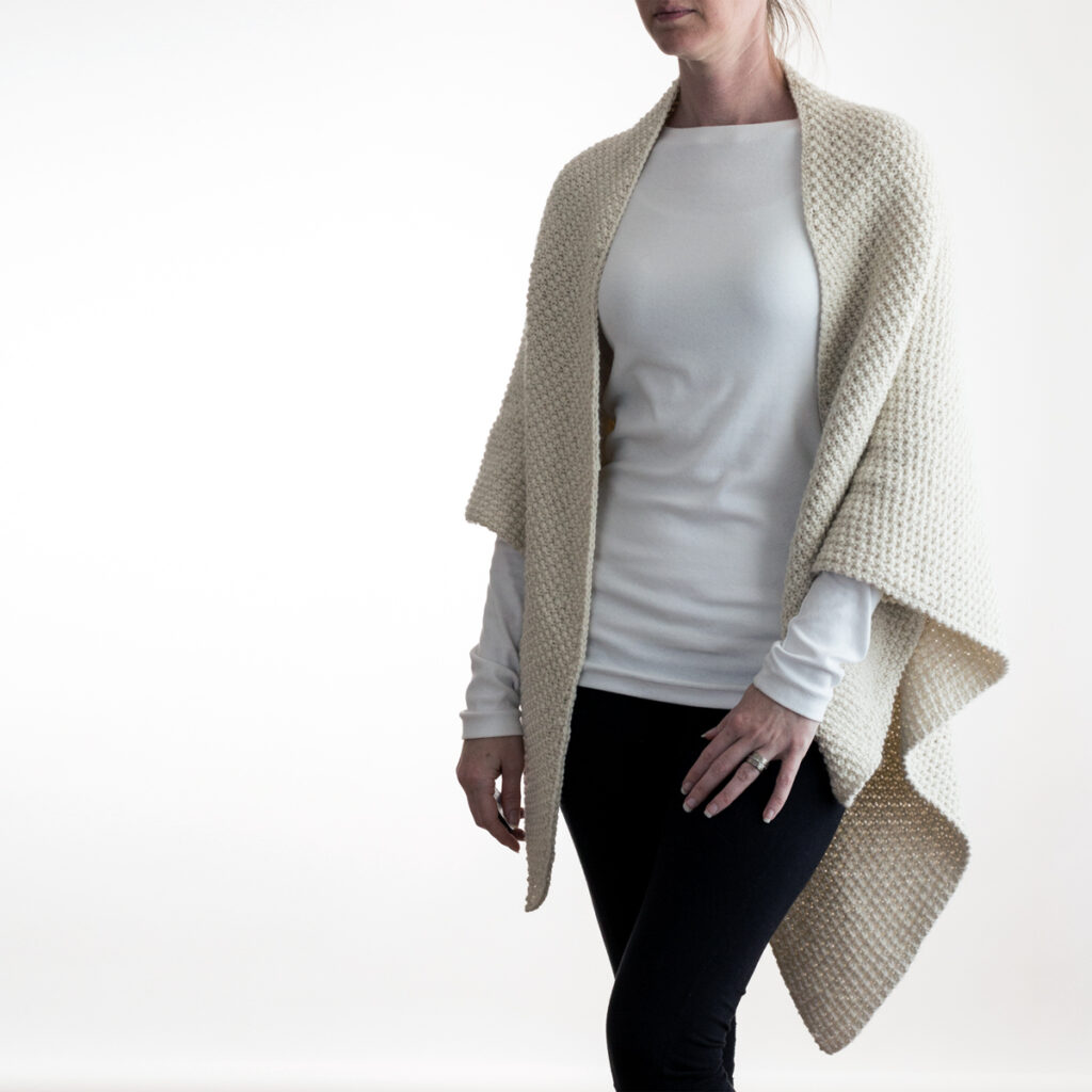 model wearing a hand knit shawl