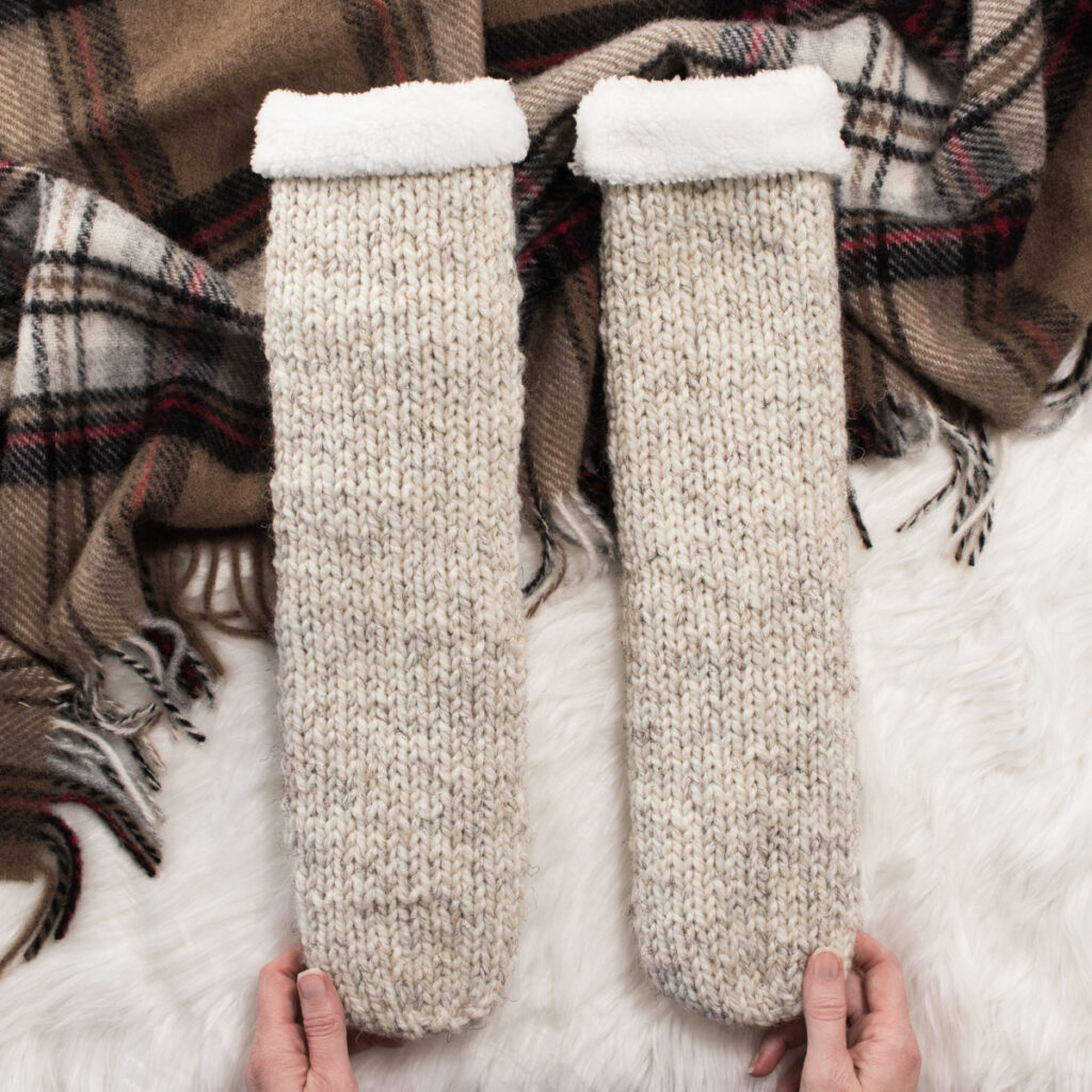 Super Chunky Knit Socks in a cozy setting with a blanket.