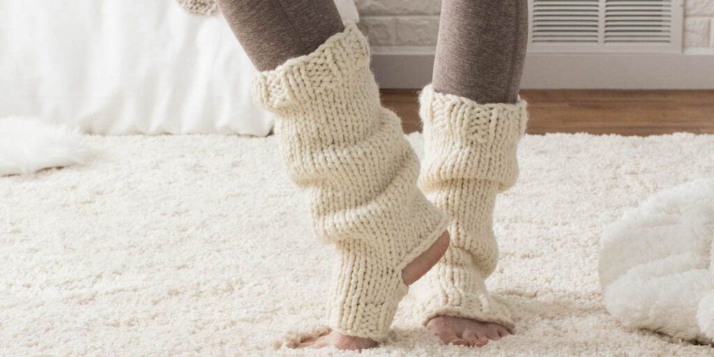 yoga sock leg warmers on a model a faux fur blanket in a cozy setting