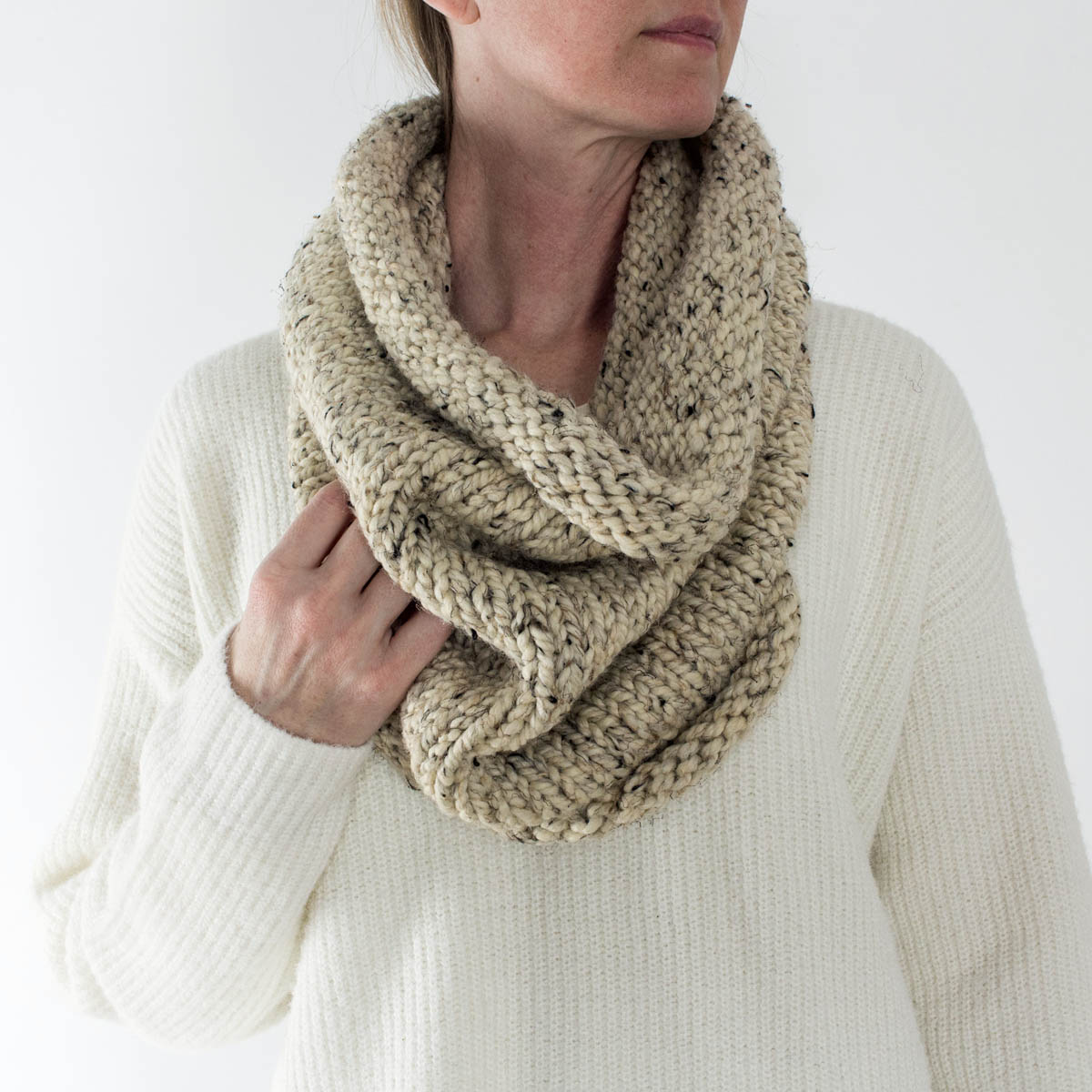 hand knit chunky stockinette stitch cowl on a model