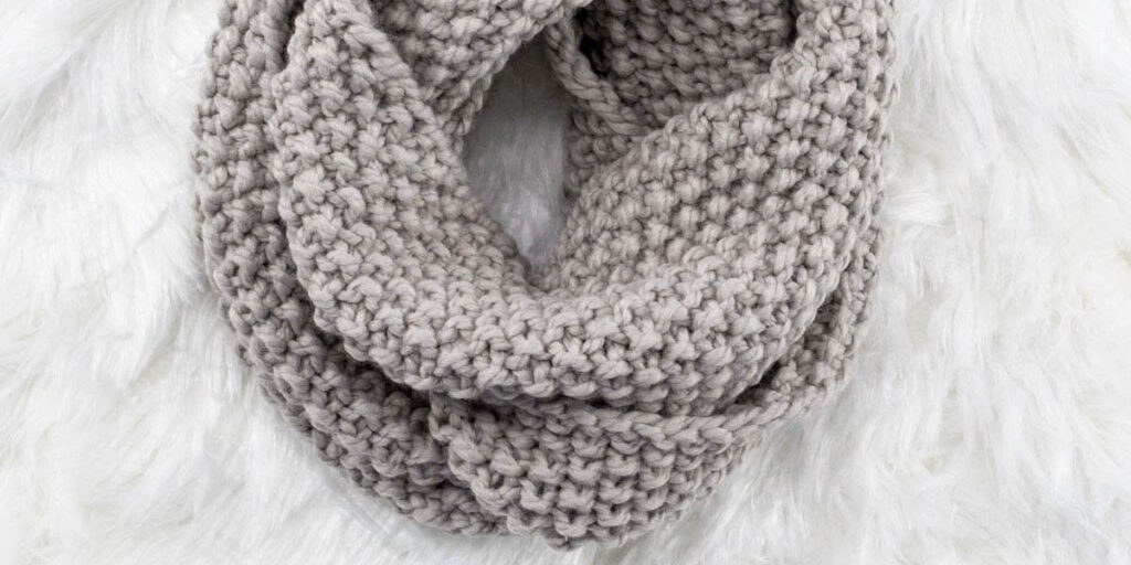up-close pic of a hand knit chunky seed stitch cowl