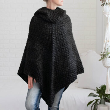 model wearing a chunky knit poncho
