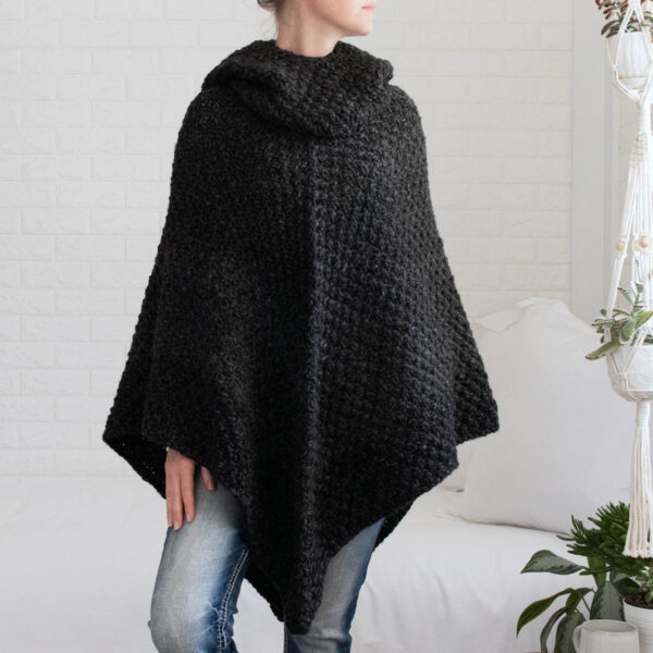 model wearing a chunky knit poncho