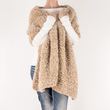 faux fur knitted rectangle shawl on a model.