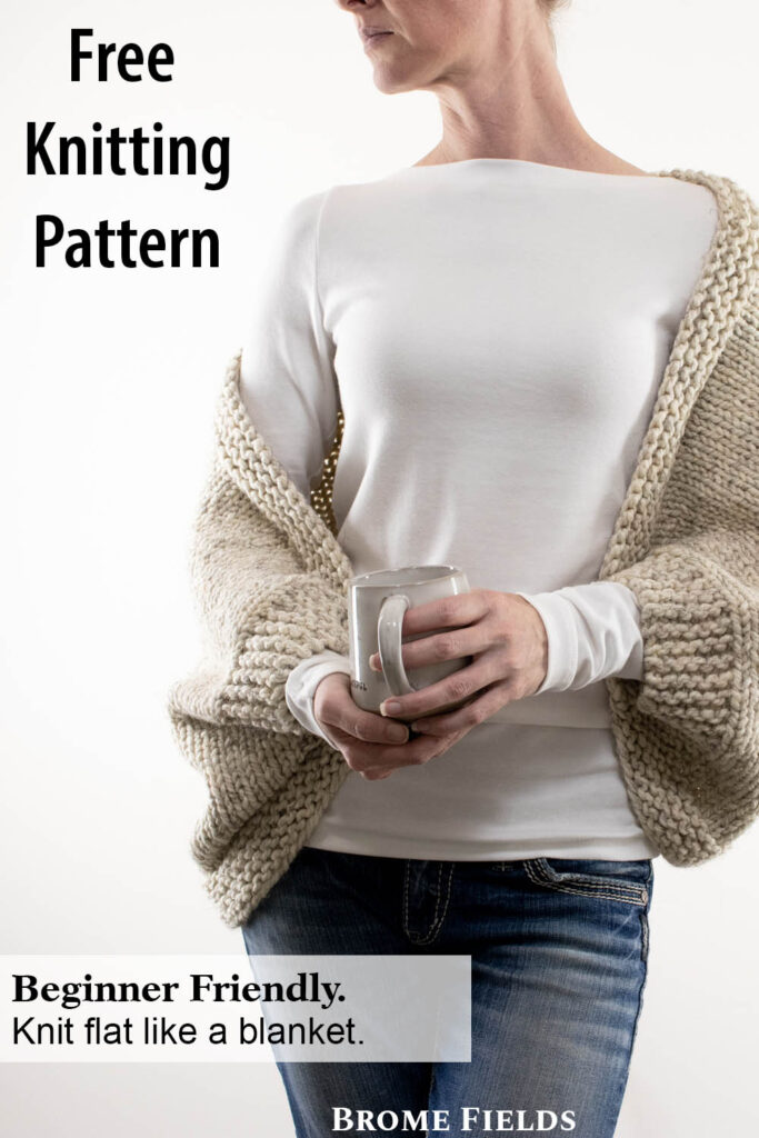 Knitted cropped shrug on a model.