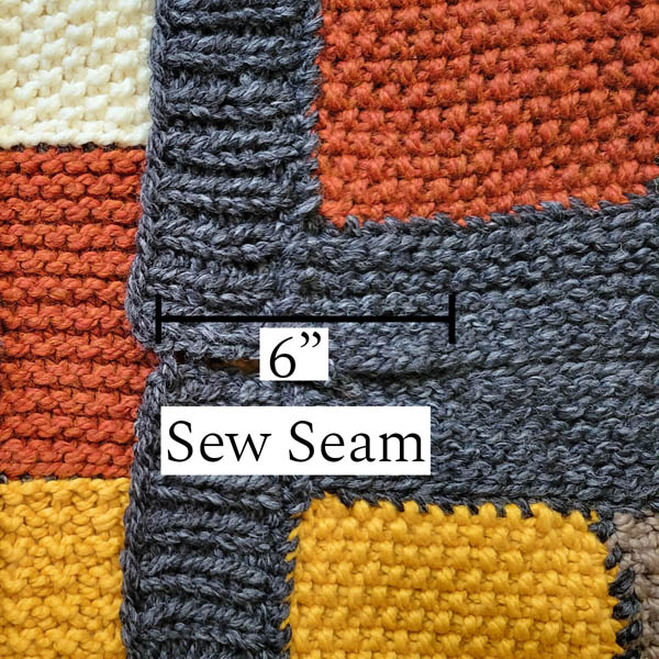 up close image of a patchwork quilted shrug showing where to seam.