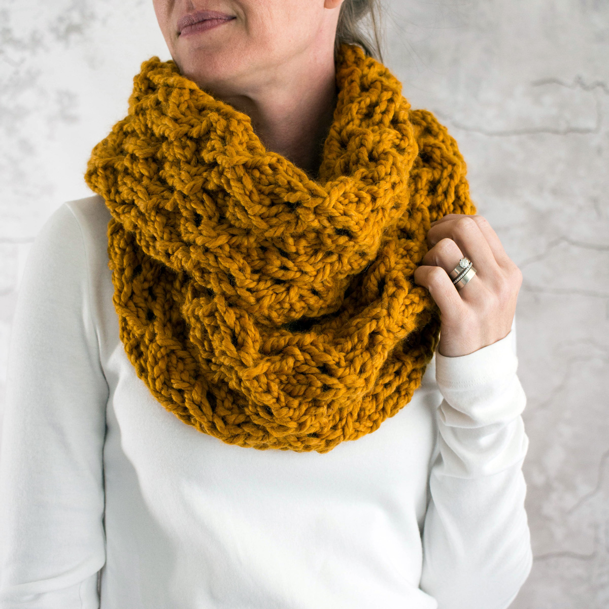 chunky lace knit scarf worn by a model